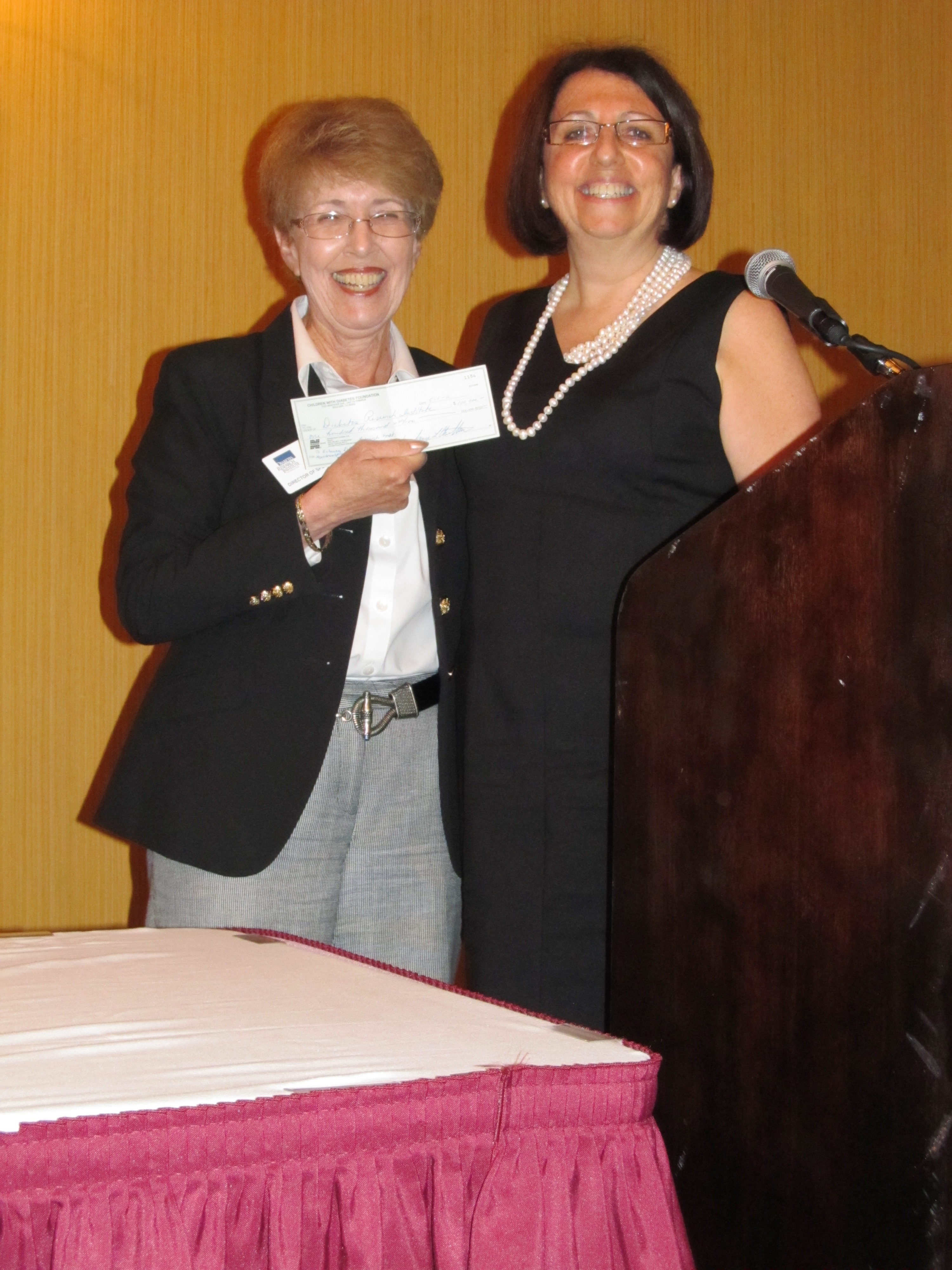 Ellen presenting a check to DRIF